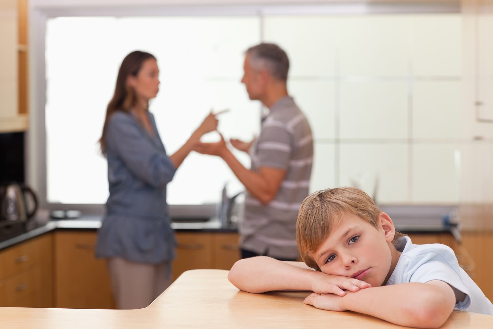 Child that is sad that his parents are arguing