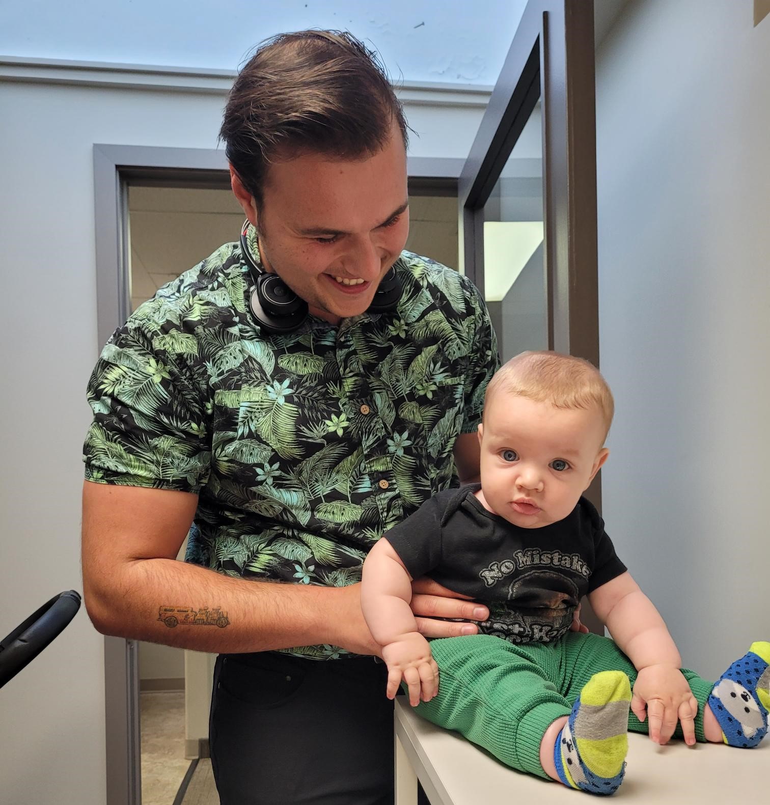 Father holding his child looking happy