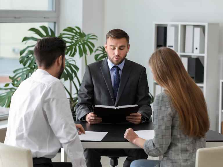 Two people going through divorce and talking to lawyer