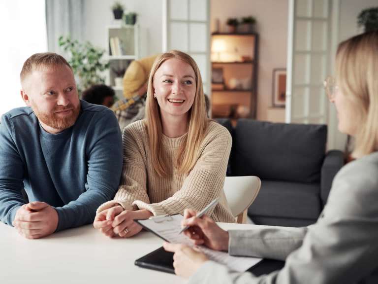 Couple who want to adopt kids talking to lawyer